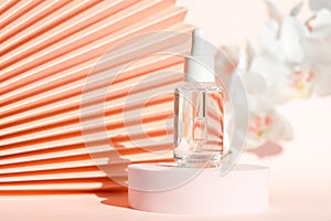 Cosmetic serum with peptides product presentation mockup on podium pedestal and chinese paper fan pink floral background