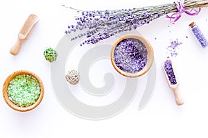 Cosmetic set with lavender herbs and sea salt in bottle on white table background flat lay mockup