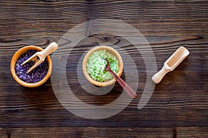 Cosmetic set with lavender herbs and sea salt in bowl on wooden table background flat lay mockup