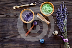 Cosmetic set with lavender herbs and sea salt in bowl on wooden table background flat lay mockup