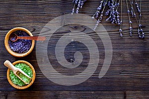 Cosmetic set with lavender herbs and sea salt in bowl on wooden table background flat lay mockup