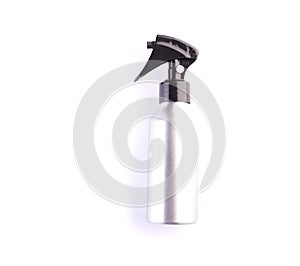 Cosmetic spray bottle isolated on white background. Closeup of plastic container for hair care or skincare with trigger pump.