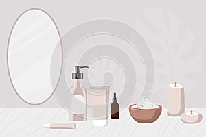 Cosmetic table with cosmetics, candles, bath salt. Wall with natural decor and oval mirror. Home Skin and Body Care