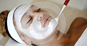 Cosmetician Applying Facial Mask