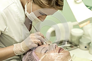 The cosmetician in a beauty salon