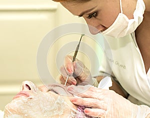 The cosmetician in a beauty salon