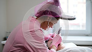 Cosmetician carries out hardware cleaning of face.