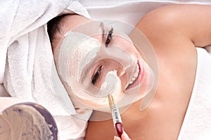 Cosmetician make mask. Facial massage.