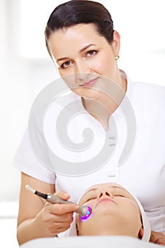 Cosmetician making lifting procedure