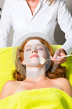 Cosmetics and Beauty - applying facial mask
