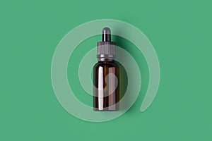 Cosmetics bottle on green background top view