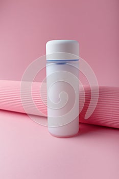 Cosmetics bottle mock up on pink background, blank label, no brand mock up. Cream refiner, shampoo, foam container for face skin photo