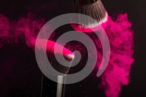 Cosmetics brush and colorful makeup powder