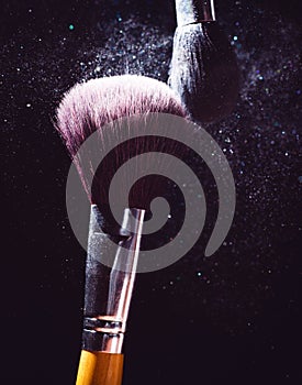 Cosmetics brush and explosion colorful makeup powder