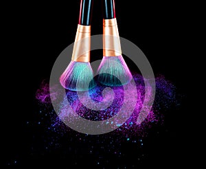 Cosmetics brush and explosion makeup dust powder photo