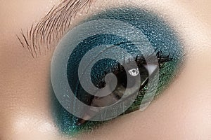 Cosmetics, close-up eye make-up. Fashion eyeshadow