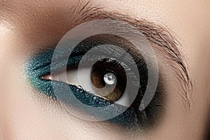 Cosmetics, close-up eye make-up. Fashion eyeshadow