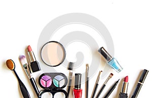 Cosmetics and fashion background with make up artist objects: lipstick, eye shadows, mascara ,eyeliner, concealer, nail polish.