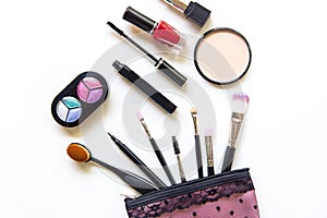 Cosmetics and fashion background with make up artist objects: lipstick, eye shadows, mascara ,eyeliner, concealer, nail polish.