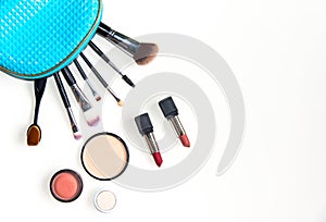 Cosmetics and fashion background with make up artist objects: lipstick, eye shadows, mascara ,eyeliner, concealer, nail polish.