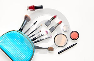 Cosmetics and fashion background with make up artist objects: lipstick, eye shadows, mascara ,eyeliner, concealer, nail polish wit