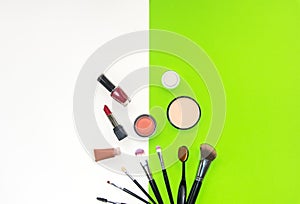 Cosmetics and fashion background with make up artist objects: lipstick, eye shadows, mascara ,eyeliner, concealer, nail polish.