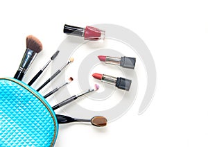 Cosmetics and fashion background with make up artist objects: lipstick, eye shadows, mascara ,eyeliner, concealer, nail polish.