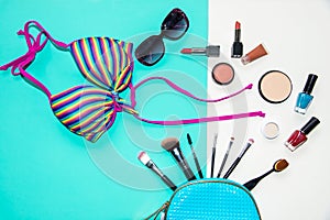 Cosmetics and fashion background with make up artist objects: lipstick, eye shadows, mascara ,eyeliner, concealer, nail polish wit