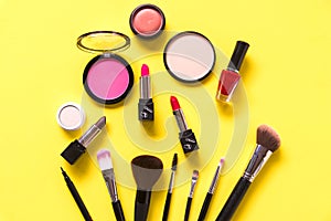 Cosmetics and fashion background with make up artist objects: lipstick, eye shadows, mascara ,eyeliner, concealer, nail polish, ye