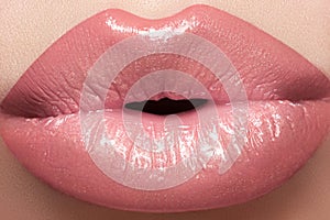 Cosmetics, gloss make-up. Macro fashion lips kiss