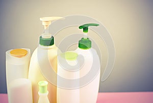 Cosmetics for hair and body care white bottles on a gray background Natural organic product Copy space selective focus