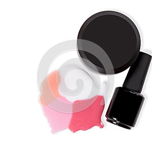 Cosmetics for hand care.Nail gel in different black containers on a white surface. Spilled nail polishes on a white