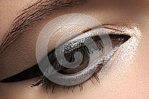 Cosmetics. Macro of beauty eye with eyeliner make-up