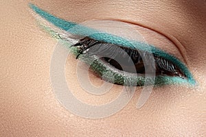 Cosmetics, macro eye make-up. Fashion mint liner eyeshadows