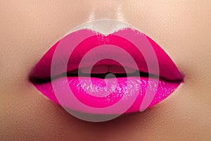 Cosmetics, Makeup. Bright Lipstick on Lips. Closeup of Beautiful Female Mouth with Fashion Pink Lip Makeup. Part of face