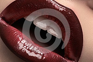 Cosmetics & makeup. Closeup fashion cherry lips glossy make-up