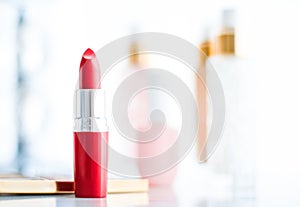 Cosmetics, makeup products on dressing vanity table, lipstick, foundation base, nailpolish and eyeshadows for luxury beauty and