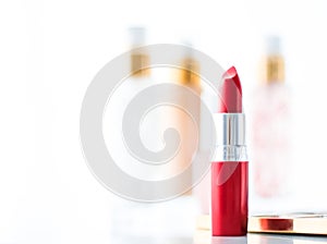 Cosmetics, makeup products on dressing vanity table, lipstick, foundation base, nailpolish and eyeshadows for luxury beauty and