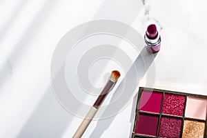 Cosmetics, makeup products set on marble vanity table, lipstick, eyeshadows and make-up brush for luxury beauty and fashion brand