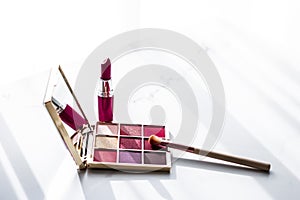 Cosmetics, makeup products set on marble vanity table, lipstick, eyeshadows and make-up brush for luxury beauty and fashion brand