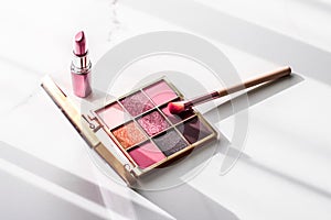 Cosmetics, makeup products set on marble vanity table, lipstick, eyeshadows and make-up brush for luxury beauty and fashion brand