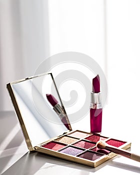 Cosmetics, makeup products set on marble vanity table, lipstick, eyeshadows and make-up brush for luxury beauty and fashion brand