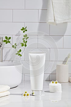 Cosmetics product and cotton towels white table inside a bathroom