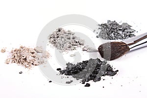 Cosmetics shadows and makeup brush