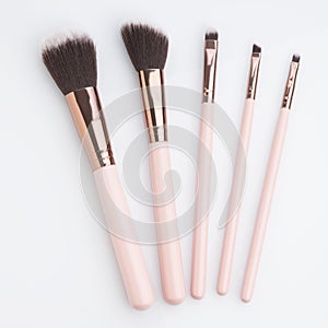 Cosmetics: Top view of Make up Brushes Shot in Studio Over White Background