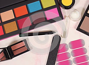 Various Cosmetics and Cosmetics Applicators on Paper