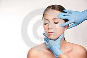 Cosmetologist apply mentoplasty. Beauty girl skin do Facelift at cosmetology spa. Women model treatment photo