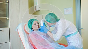 Cosmetology doctor female reviewing of her pation in medical clinic