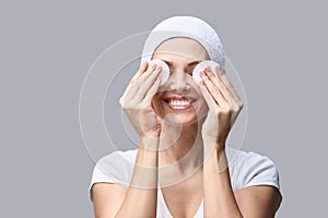 Cosmetology face cleaning. Female portrait. White cotton pad photo