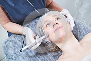 Cosmetology. female facial skin beauty procedure in salon